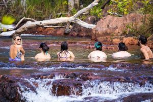 Travellers swimming in Litchfield National Park